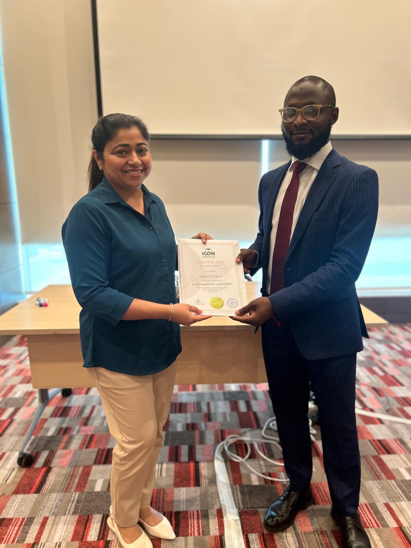 A programme participant receiving a certificate after completing a professional training session